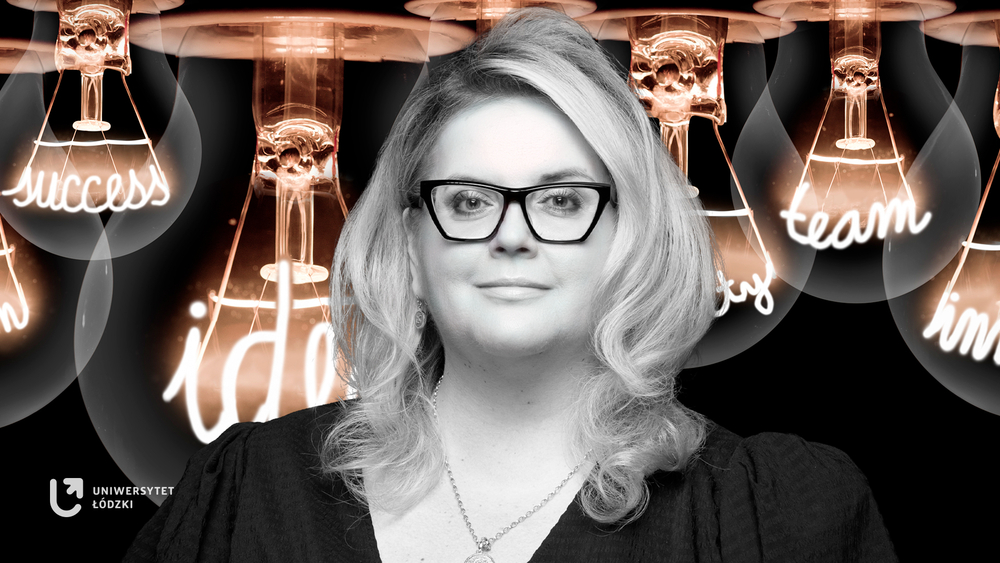 Dr Kinga Stopczyńska against the background of large abstract light bulbs with illuminated inspirational words in place of the filaments